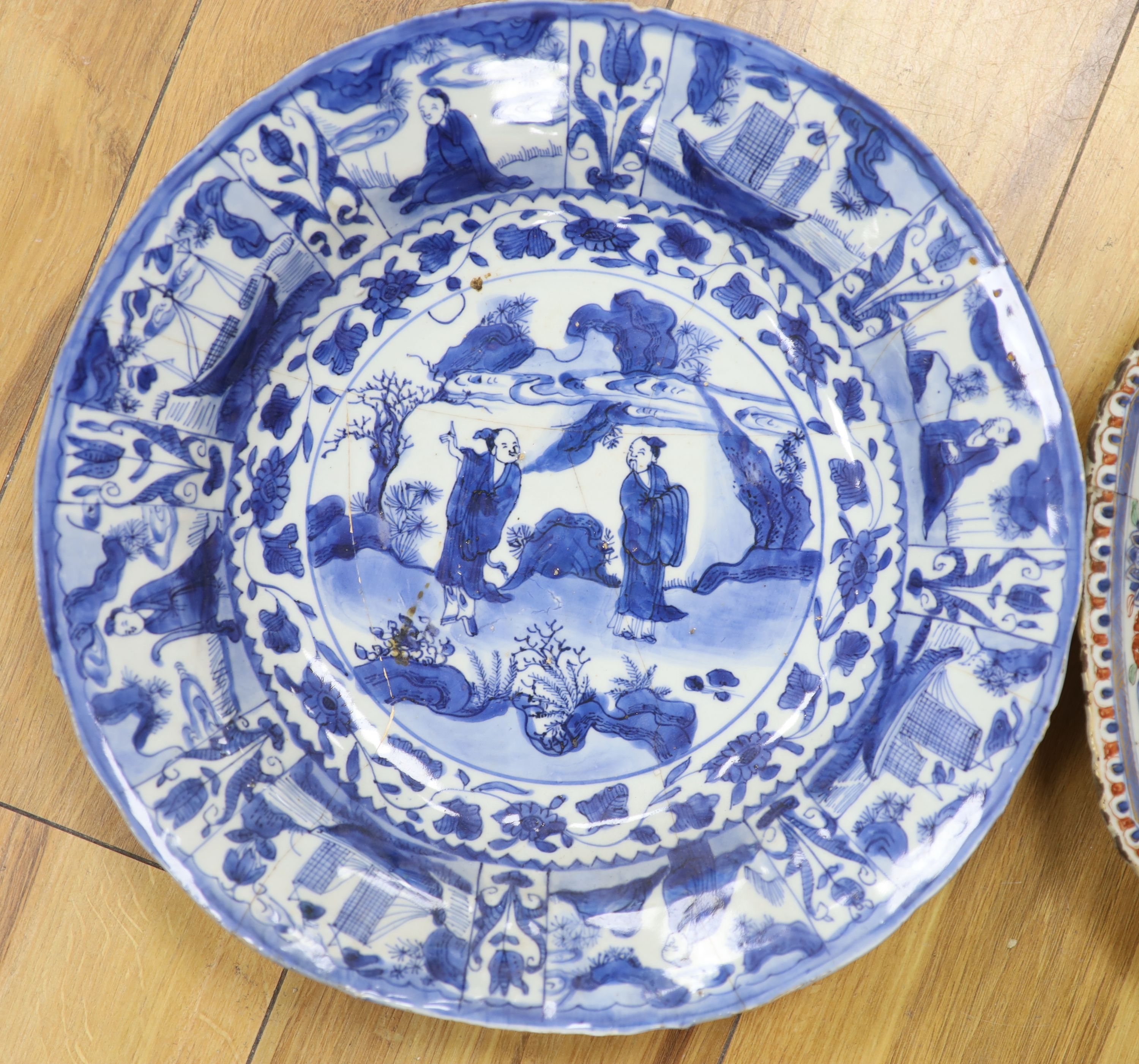 A Chinese Ming kraak blue and white dish, c.1640, together with a Kangxi Imari dish, c.1715, largest diameter 39cm